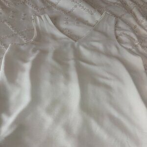 Cream sleeveless blouse